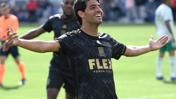 Feb 26, 2022; Los Angeles, California, USA;  Los Angeles FC forward Carlos Vela (10) celebrates with fans after scoring his third goal of the game against the Colorado Rapids at Banc of California Stadium. Mandatory Credit: Jayne Kamin-Oncea-USA TODAY Sports