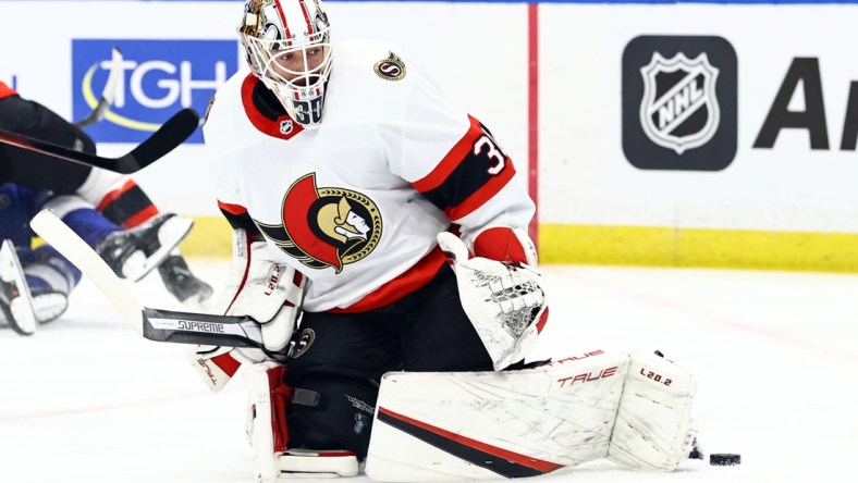 Mar 1, 2022; Tampa, Florida, USA; Ottawa Senators goaltender Matt Murray (30) makes a save against the Tampa Bay Lightning during the first period at Amalie Arena. Mandatory Credit: Kim Klement-USA TODAY Sports