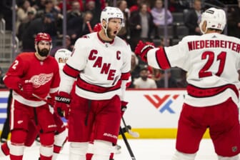 Mar 1, 2022; Detroit, Michigan, USA; Carolina Hurricanes center Jordan Staal (11) celebrates with right wing Nino Niederreiter (21) after scoring a goal during the third period against the Detroit Red Wings at Little Caesars Arena. Mandatory Credit: Raj Mehta-USA TODAY Sports