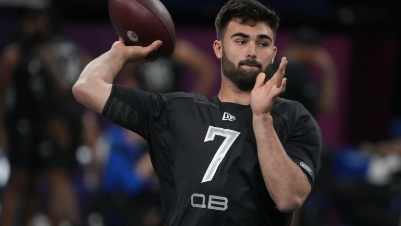 Mar 3, 2022; Indianapolis, IN, USA; North Carolina quarterback Sam Howell (QB07) goes through drills during the 2022 NFL Scouting Combine at Lucas Oil Stadium. Mandatory Credit: Kirby Lee-USA TODAY Sports