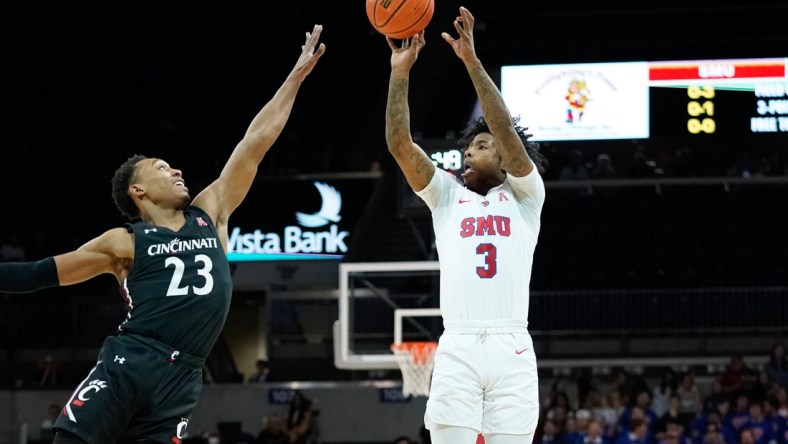 Mar 3, 2022; Dallas, Texas, USA; Southern Methodist Mustangs guard Kendric Davis (3) shoots over Cincinnati Bearcats guard Mika Adams-Woods (23) during the first half at Moody Coliseum. Mandatory Credit: Chris Jones-USA TODAY Sports