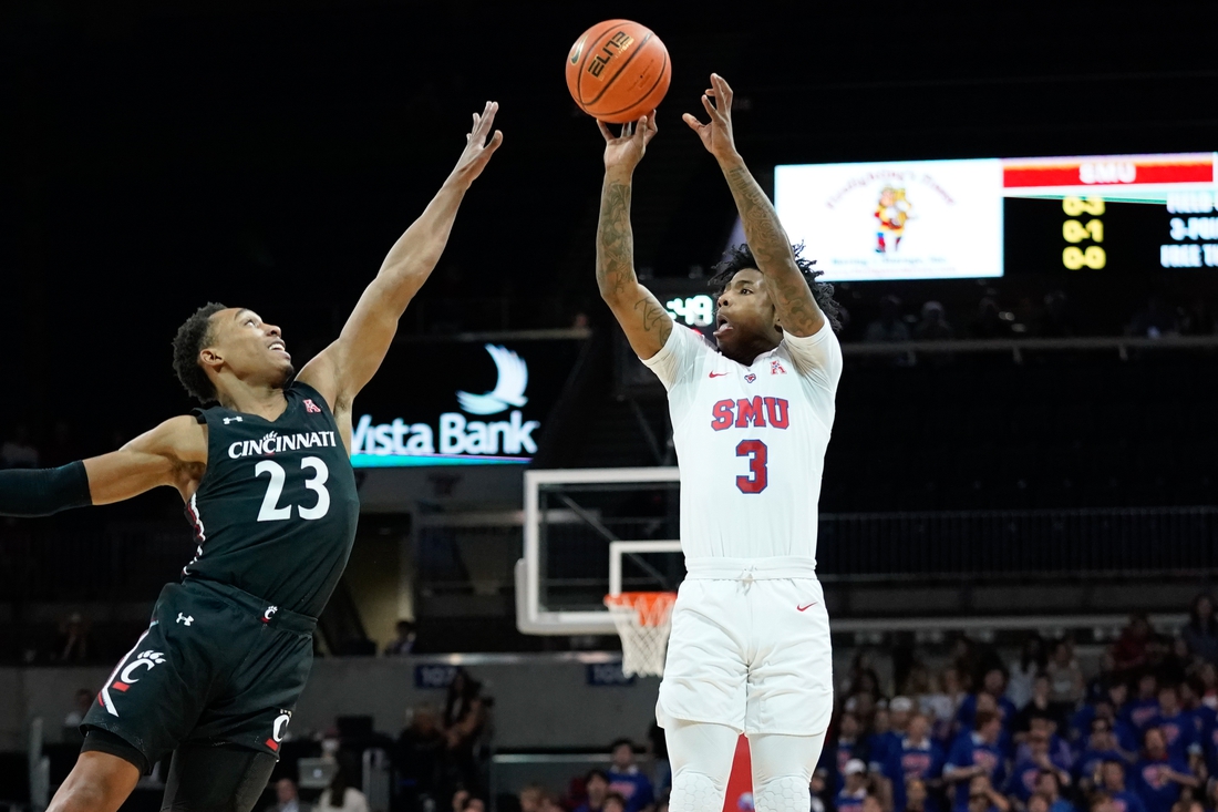 Mar 3, 2022; Dallas, Texas, USA; Southern Methodist Mustangs guard Kendric Davis (3) shoots over Cincinnati Bearcats guard Mika Adams-Woods (23) during the first half at Moody Coliseum. Mandatory Credit: Chris Jones-USA TODAY Sports