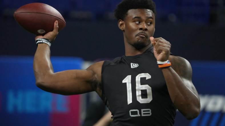 Mar 3, 2022; Indianapolis, IN, USA; Liberty quarterback Malik Willis (QB16) goes through drills during the 2022 NFL Scouting Combine at Lucas Oil Stadium. Mandatory Credit: Kirby Lee-USA TODAY Sports