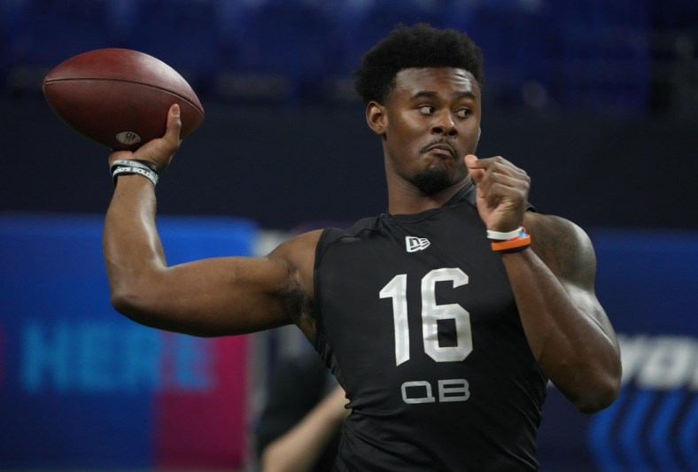 Mar 3, 2022; Indianapolis, IN, USA; Liberty quarterback Malik Willis (QB16) goes through drills during the 2022 NFL Scouting Combine at Lucas Oil Stadium. Mandatory Credit: Kirby Lee-USA TODAY Sports