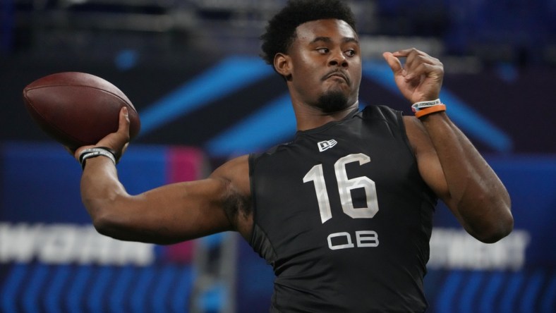 Mar 3, 2022; Indianapolis, IN, USA; Liberty quarterback Malik Willis (QB16) goes through a drill during the 2022 NFL Scouting Combine at Lucas Oil Stadium. Mandatory Credit: Kirby Lee-USA TODAY Sports