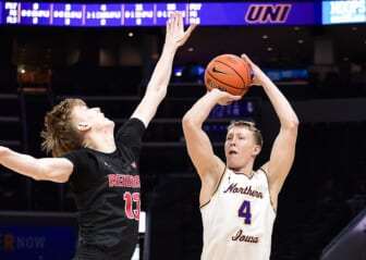 Mar 4, 2022; St. Louis, MO, USA;  Northern Iowa Panthers guard AJ Green (4) shoots as Illinois State Redbirds forward Liam McChesney (13) defends during the first half in the quarterfinals round of the Missouri Valley Conference Tournament at Enterprise Center. Mandatory Credit: Jeff Curry-USA TODAY Sports