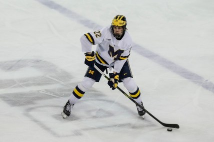 Michigan defenseman Owen Power (22) looks to pass against Michigan State during the third period in the first game of Big Ten quarterfinal at Yost Ice Arena in Ann Arbor on Friday, March 4, 2022.