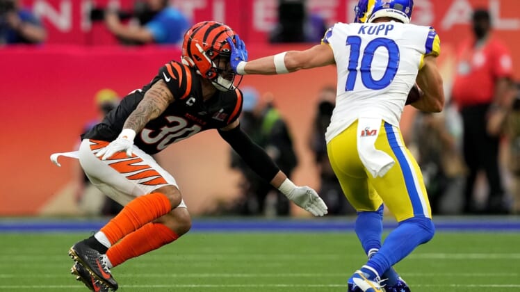 Los Angeles Rams wide receiver Cooper Kupp (10) stiff arms Cincinnati Bengals free safety Jessie Bates (30) after a catch in the first quarter during Super Bowl 56, Sunday, Feb. 13, 2022, at SoFi Stadium in Inglewood, Calif. The Cincinnati Bengals lost, 23-20.Nfl Super Bowl 56 Los Angeles Rams Vs Cincinnati Bengals Feb 13 2022 0676