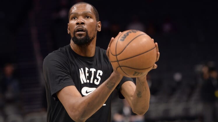 Mar 8, 2022; Charlotte, North Carolina, USA;  Brooklyn Nets forward Kevin Durant (7) warms up before the game against the Charlotte Hornets at the Spectrum Center. Mandatory Credit: Sam Sharpe-USA TODAY Sports