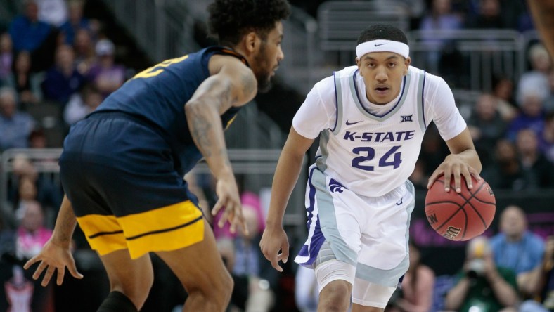 Mar 9, 2022; Kansas City, MO, USA; Kansas State Wildcats guard Nijel Pack (24) brings the ball up court during the second half against the West Virginia Mountaineers at T-Mobile Center. Mandatory Credit: William Purnell-USA TODAY Sports