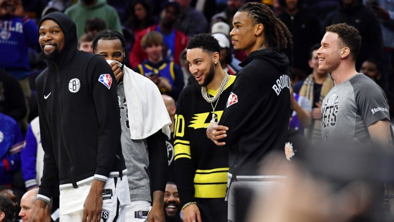 Mar 10, 2022; Philadelphia, Pennsylvania, USA; Brooklyn Nets forward Kevin Durant (7) and guard Ben Simmons (10) on the bench late in the fourth quarter of win against the Philadelphia 76ers at Wells Fargo Center. Mandatory Credit: Eric Hartline-USA TODAY Sports