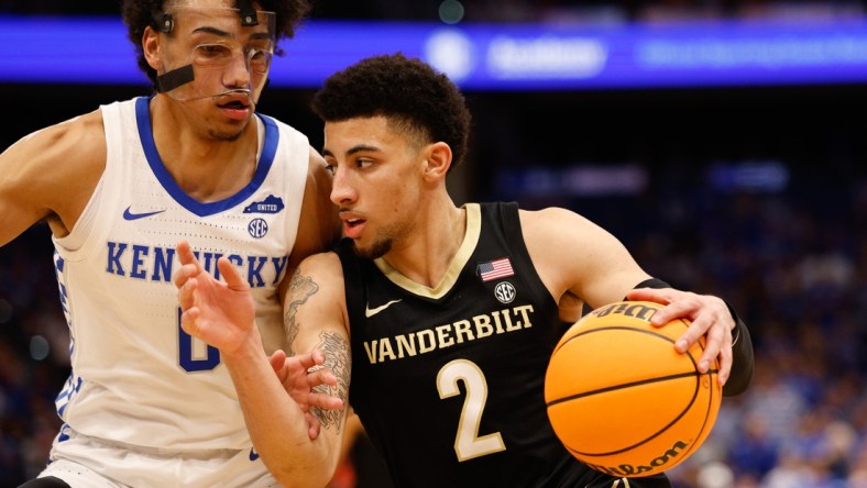 Mar 11, 2022; Tampa, FL, USA; Vanderbilt Commodores guard Scotty Pippen Jr. (2) drives to the basket while guarded by Kentucky Wildcats forward Jacob Toppin (0) in the second half at Amelie Arena. Mandatory Credit: Nathan Ray Seebeck-USA TODAY Sports