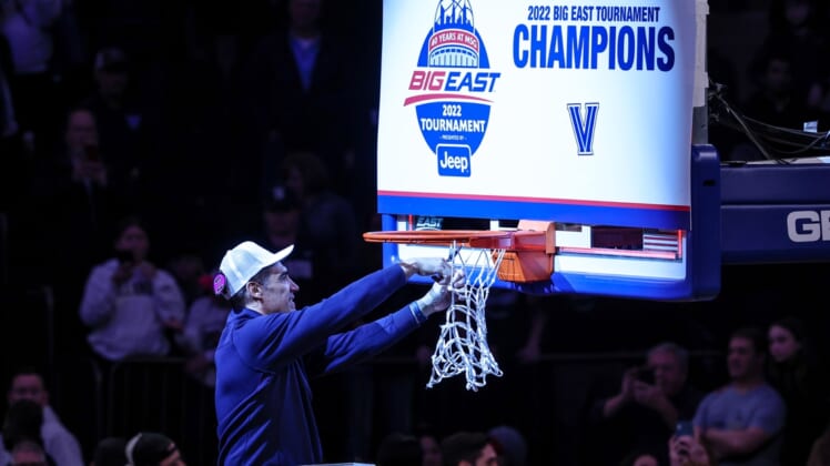 Mar 12, 2022; New York, NY, USA; Villanova Wildcats head coach Jay Wright cuts down the net after defeating Creighton Bluejays in the 2022 Big East Conference Tournament championship game at Madison Square Garden. Mandatory Credit: Vincent Carchietta-USA TODAY Sports