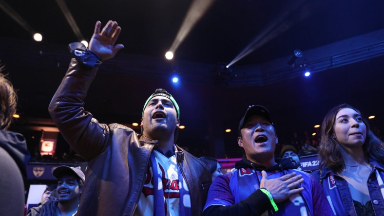 Fans Mark Escamilla, left, and John Chun, right, cheer for Austin FC eMLS player John Garcia during the eMLS Cup tournament at the Moody Theater on March 13, 2022. The eMLS Cup is the championship tournament that determines which player is the best FIFA esports player in North America.

Aem Sxsw Emls Cup 17