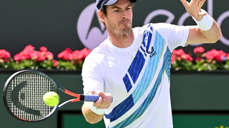 Mar 13, 2022; Indian Wells, CA, USA;  Andy Murray (GBR) hits a shot against Alexander Bublik (KAZ) during a second round match at the BNP Paribas Open at the Indian Wells Tennis Garden. Mandatory Credit: Jayne Kamin-Oncea-USA TODAY Sports