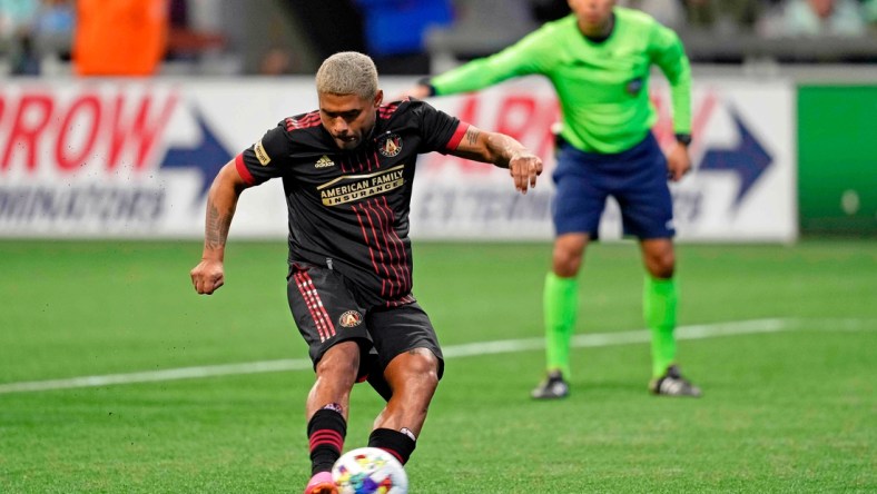 Mar 13, 2022; Atlanta, Georgia, USA; Atlanta United forward Josef Martinez (7) scores on a penalty kick against Charlotte FC during the second half at Mercedes-Benz Stadium. Atlanta United won 2-1. Mandatory Credit: Dale Zanine-USA TODAY Sports