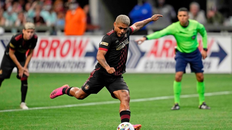 Mar 13, 2022; Atlanta, Georgia, USA; Atlanta United forward Josef Martinez (7) scores on a penalty kick against Charlotte FC during the second half at Mercedes-Benz Stadium. Atlanta United won 2-1. Mandatory Credit: Dale Zanine-USA TODAY Sports