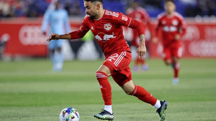 Mar 13, 2022; Harrison, New Jersey, USA; New York Red Bulls midfielder Luquinhas (82) dribbles the ball against Minnesota United during the second half at Red Bull Arena. Mandatory Credit: Vincent Carchietta-USA TODAY Sports