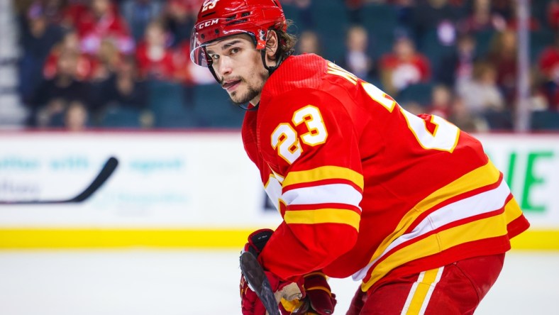 Mar 12, 2022; Calgary, Alberta, CAN; Calgary Flames center Sean Monahan (23) during the face off against the Detroit Red Wings during the second period at Scotiabank Saddledome. Mandatory Credit: Sergei Belski-USA TODAY Sports