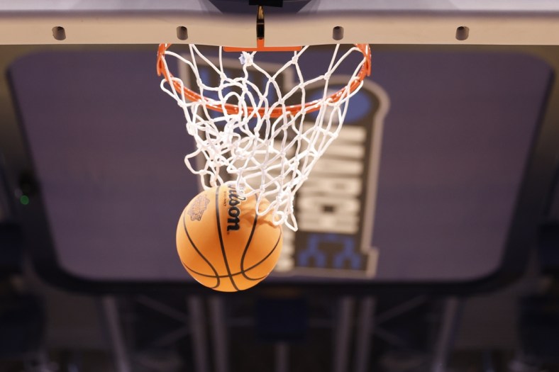 Mar 14, 2022; Dayton, OH, USA; General view of the ball going through the net during practice the day before the start of the First Four of the 2022 NCAA Tournament at UD Arena. Mandatory Credit: Rick Osentoski-USA TODAY Sports