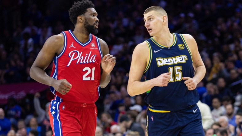 Mar 14, 2022; Philadelphia, Pennsylvania, USA; Philadelphia 76ers center Joel Embiid (21) and Denver Nuggets center Nikola Jokic (15) during the first quarter at Wells Fargo Center. Mandatory Credit: Bill Streicher-USA TODAY Sports