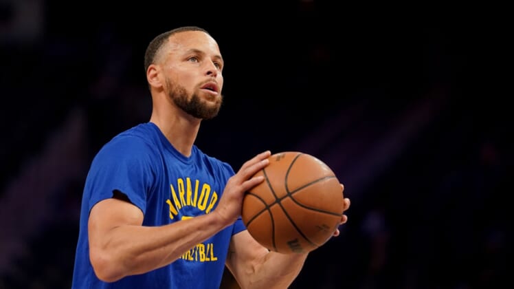 Mar 16, 2022; San Francisco, California, USA; Golden State Warriors guard Stephen Curry (30) warms up before the start of the game against the Boston Celtics at the Chase Center. Mandatory Credit: Cary Edmondson-USA TODAY Sports
