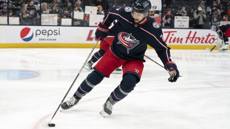 Mar 19, 2022; Columbus, Ohio, USA;  Columbus Blue Jackets center Sean Kuraly (7) skates with the puck in warm-ups prior to the game against St. Louis Blues at Nationwide Arena. Mandatory Credit: Jason Mowry-USA TODAY Sports