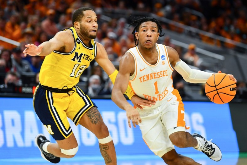 Tennessee guard Kennedy Chandler (1) is defended by Michigan guard DeVante' Jones (12) during the NCAA Tournament second round game between Tennessee and Michigan at Gainbridge Fieldhouse in Indianapolis, Ind., on Saturday, March 19, 2022.

Kns Ncaa Vols Michigan Bp