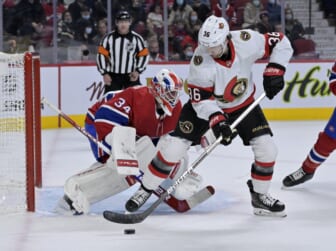 Mar 19, 2022; Montreal, Quebec, CAN; Montreal Canadiens goalie Jake Allen (34) stops Ottawa Senators forward Colin White (36) during the first period at the Bell Centre. Mandatory Credit: Eric Bolte-USA TODAY Sports