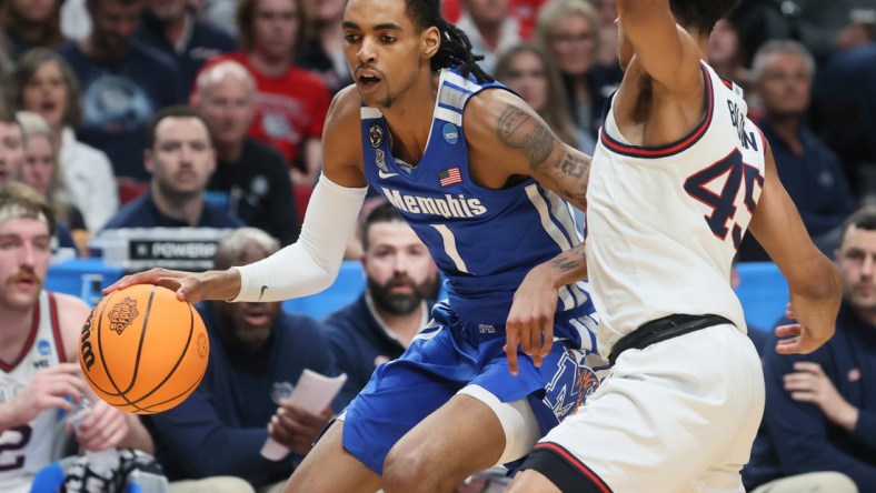 Memphis Tigers guard Emoni Bates drives past Gonzaga Bulldogs guard Rasir Bolton during their second round NCAA Tournament matchup on Saturday, March 19, 2022 at the Moda Center in Portland, Ore.

Jrca3056