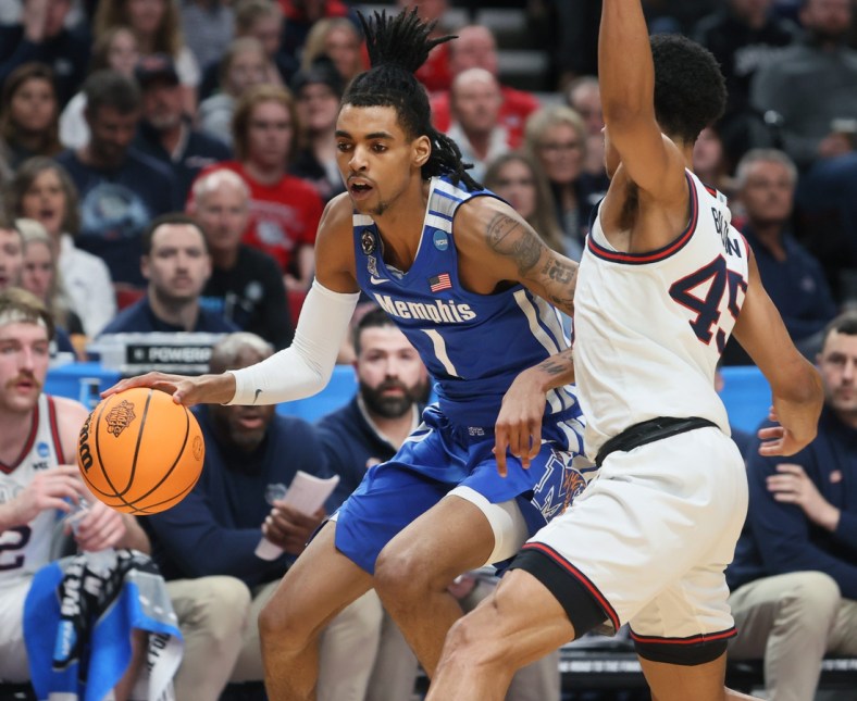 Memphis Tigers guard Emoni Bates drives past Gonzaga Bulldogs guard Rasir Bolton during their second round NCAA Tournament matchup on Saturday, March 19, 2022 at the Moda Center in Portland, Ore.

Jrca3056
