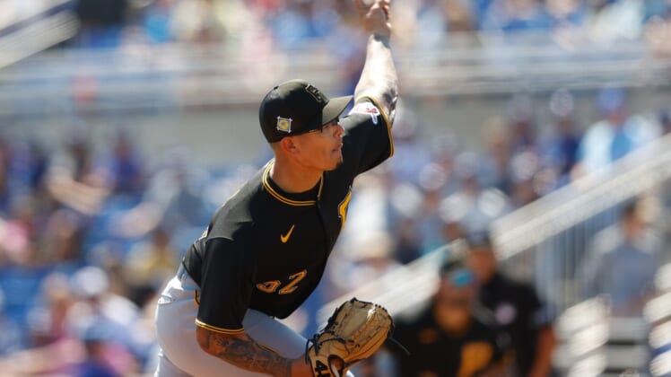 Mar 20, 2022; Dunedin, Florida, USA; Pittsburgh Pirates pitcher Anthony Banda (52) throws a pitch in the fifth inning against the Toronto Blue Jays during spring training at TD Ballpark. Mandatory Credit: Nathan Ray Seebeck-USA TODAY Sports