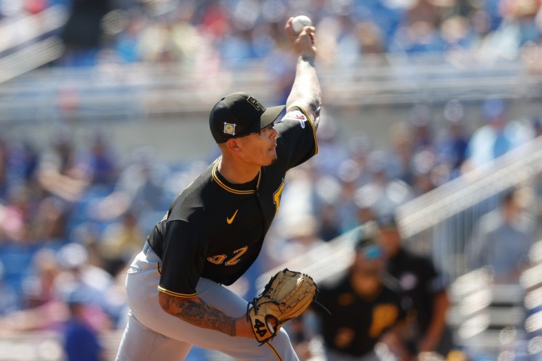 Mar 20, 2022; Dunedin, Florida, USA; Pittsburgh Pirates pitcher Anthony Banda (52) throws a pitch in the fifth inning against the Toronto Blue Jays during spring training at TD Ballpark. Mandatory Credit: Nathan Ray Seebeck-USA TODAY Sports