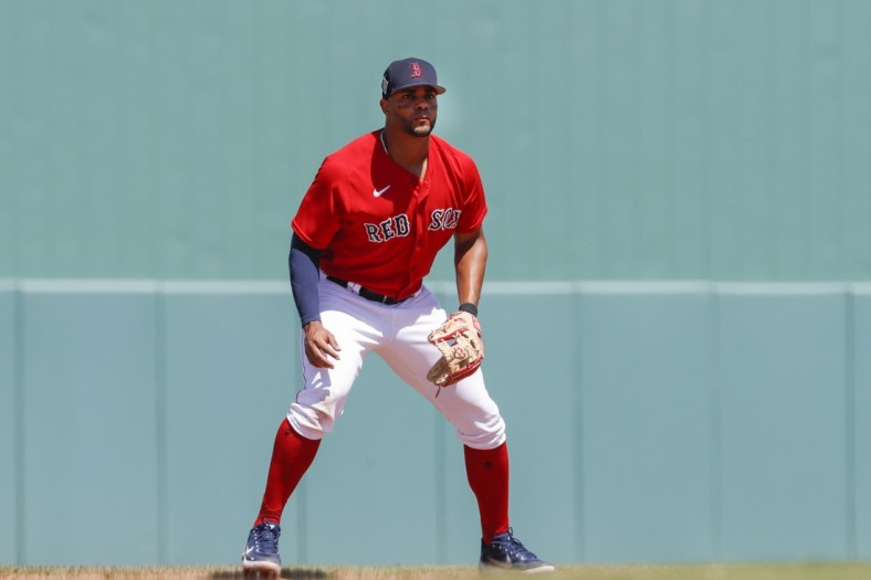 Mar 21, 2022; Fort Myers, Florida, USA; Boston Red Sox shortstop Xander Bogaerts (2) looks own from the field during the fourth inning of the game against the Atlanta Braves during spring training at JetBlue Park at Fenway South. Mandatory Credit: Sam Navarro-USA TODAY Sports