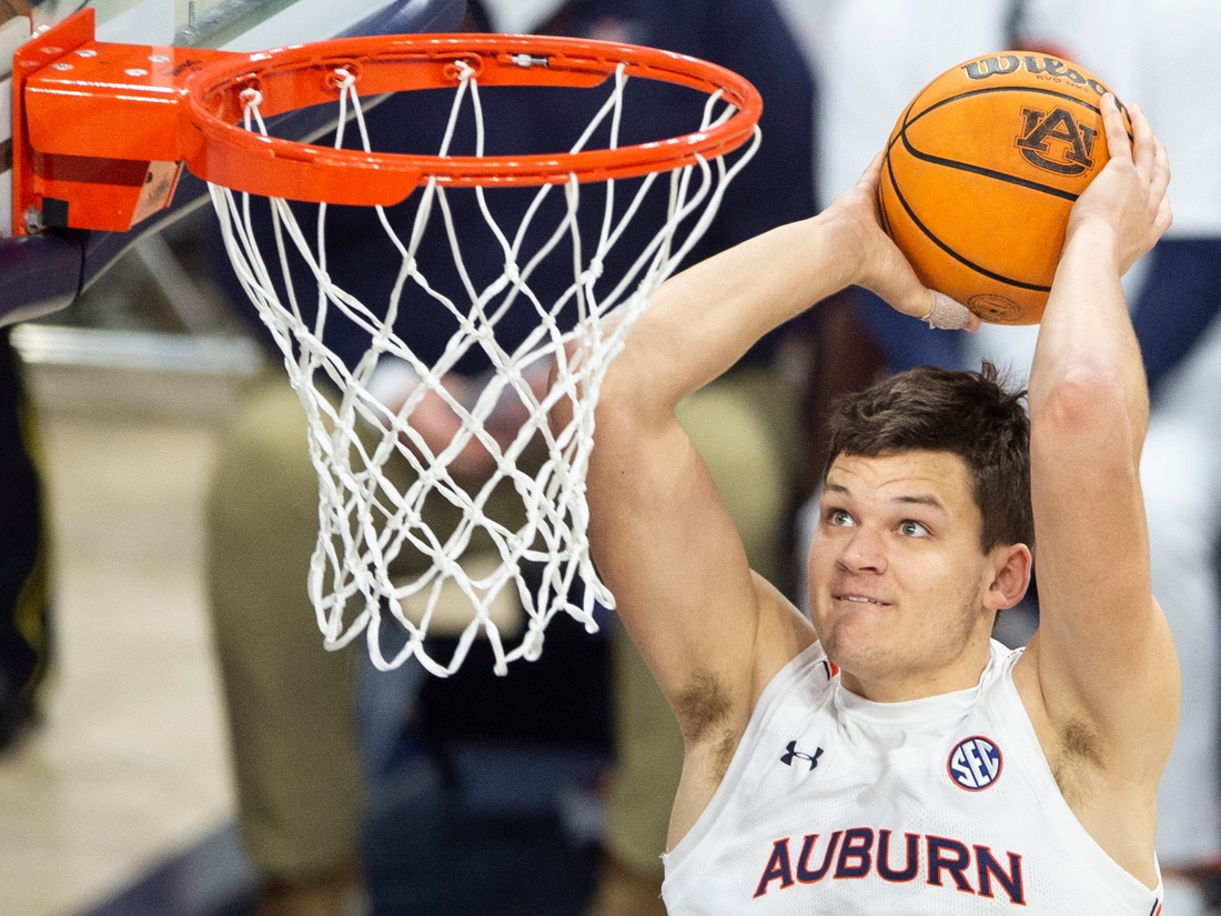 Auburn Tigers player Walker Kessler (13) dunks the ball as Auburn Tigers men's basketball takes on Texas A&M Aggies at Auburn Arena in Auburn, Ala., on Saturday, Feb. 12, 2022. Auburn Tigers defeated Texas A&M Aggies 75-58.