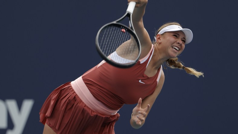 Mar 22, 2022; Miami Gardens, FL, USA; Amanda Anisimova of the United States serves against Shelby Rogers of the United States (not pictured) in a first round women's singles match in the Miami Open at Hard Rock Stadium. Mandatory Credit: Geoff Burke-USA TODAY Sports