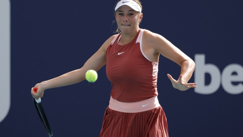 Mar 22, 2022; Miami Gardens, FL, USA; Amanda Anisimova of the United States hits a forehand against Shelby Rogers of the United States (not pictured) in a first round women's singles match in the Miami Open at Hard Rock Stadium. Mandatory Credit: Geoff Burke-USA TODAY Sports