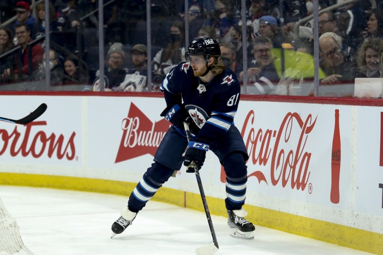 Mar 22, 2022; Winnipeg, Manitoba, CAN;  Winnipeg Jets forward Kyle Connor (81) looks to make a pass in the Vegas Golden Knights zone during the second period at Canada Life Centre. Mandatory Credit: Terrence Lee-USA TODAY Sports