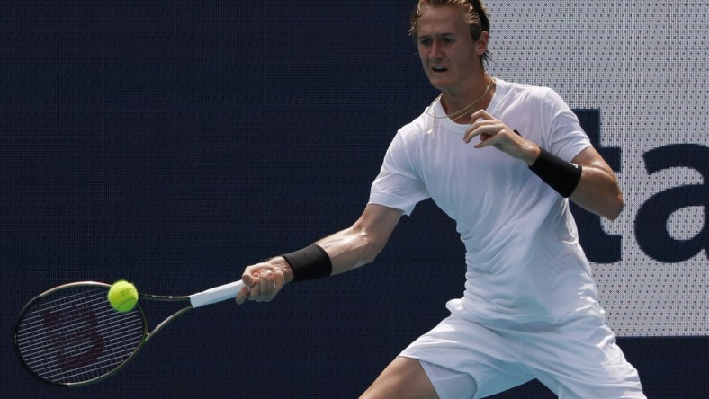 Mar 24, 2022; Miami Gardens, FL, USA; Sebastian Korda (USA) hits a forehand against Alejandro Davidovich Fokina (ESP) (not pictured) in a first round men's singles match in the Miami Open at Hard Rock Stadium. Mandatory Credit: Geoff Burke-USA TODAY Sports