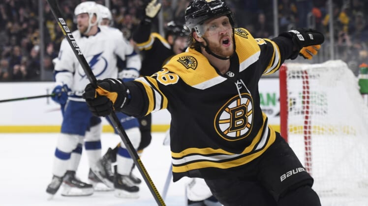 Mar 24, 2022; Boston, Massachusetts, USA;  Boston Bruins right wing David Pastrnak (88) reacts after scoring a goal for a hat trick during the third period against the Tampa Bay Lightning at TD Garden. Mandatory Credit: Bob DeChiara-USA TODAY Sports
