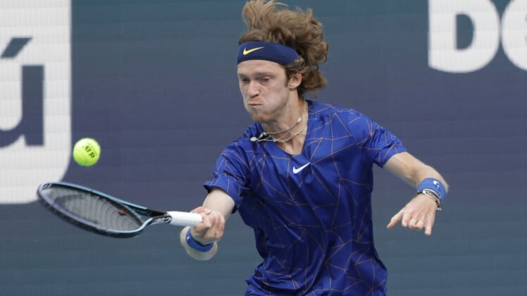 Mar 25, 2022; Miami Gardens, FL, USA; Andrey Rublev hits a forehand against Nick Krygios (not pictured) in a second round men's match in the Miami Open at Hard Rock Stadium. Mandatory Credit: Geoff Burke-USA TODAY Sports