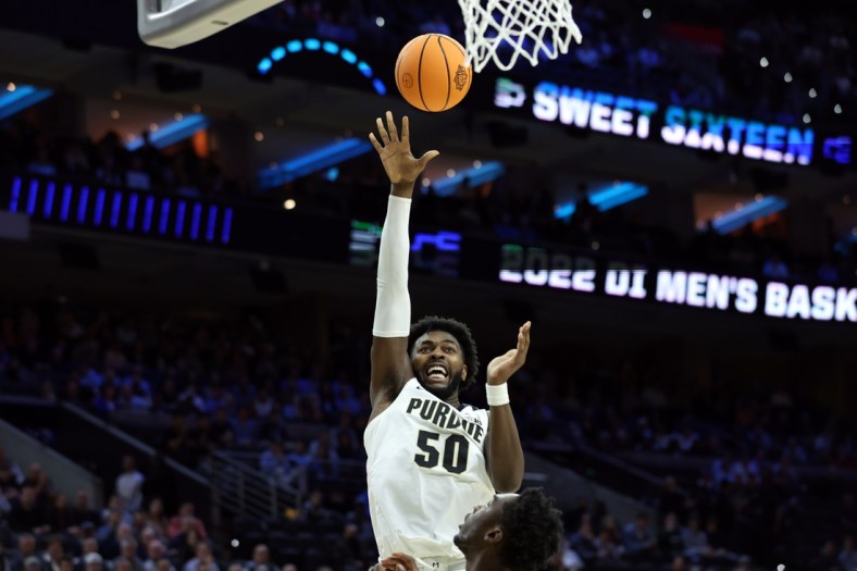 Mar 25, 2022; Philadelphia, PA, USA; Purdue Boilermakers forward Trevion Williams (50) shoots against St. Peter's Peacocks forward KC Ndefo (11) in the first half in the semifinals of the East regional of the men's college basketball NCAA Tournament at Wells Fargo Center. Mandatory Credit: Bill Streicher-USA TODAY Sports