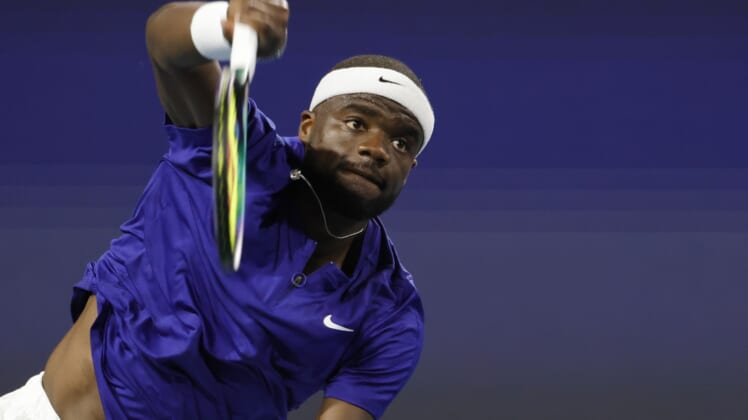 Mar 25, 2022; Miami Gardens, FL, USA; Frances Tiafoe (USA) serves against Brandon Nakashima (USA) (not pictured) in a second round men's singles match in the Miami Open at Hard Rock Stadium. Mandatory Credit: Geoff Burke-USA TODAY Sports