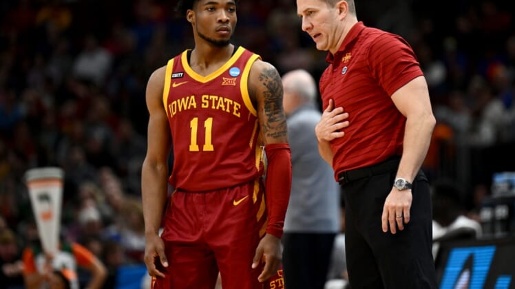 Mar 25, 2022; Chicago, IL, USA; Iowa State Cyclones head coach T.J. Otzelberger talks to guard Tyrese Hunter (11) during the second half against the Miami Hurricanes in the semifinals of the Midwest regional of the men's college basketball NCAA Tournament at United Center. Mandatory Credit: Jamie Sabau-USA TODAY Sports