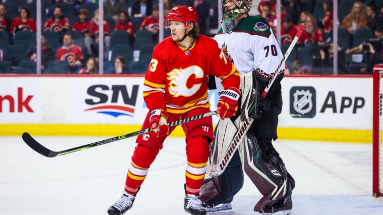 Mar 25, 2022; Calgary, Alberta, CAN; Calgary Flames right wing Tyler Toffoli (73) screens in front of Arizona Coyotes goaltender Karel Vejmelka (70) during the third period at Scotiabank Saddledome. Mandatory Credit: Sergei Belski-USA TODAY Sports