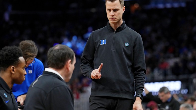 Mar 26, 2022; San Francisco, CA, USA; Duke Blue Devils associate head coach Jon Scheyer gestures to head coach Mike Krzyzewski before the game against the Arkansas Razorbacks the finals of the West regional of the men's college basketball NCAA Tournament at Chase Center. Mandatory Credit: Kelley L Cox-USA TODAY Sports