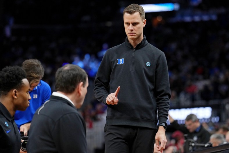 Mar 26, 2022; San Francisco, CA, USA; Duke Blue Devils associate head coach Jon Scheyer gestures to head coach Mike Krzyzewski before the game against the Arkansas Razorbacks the finals of the West regional of the men's college basketball NCAA Tournament at Chase Center. Mandatory Credit: Kelley L Cox-USA TODAY Sports