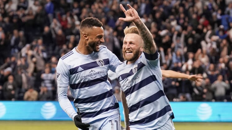 Mar 26, 2022; Kansas City, Kansas, USA; Sporting Kansas City forward Johnny Russell (7) celebrates with forward Khiry Shelton (11) after scoring against Real Salt Lake during the second half at Children's Mercy Park. Mandatory Credit: Denny Medley-USA TODAY Sports