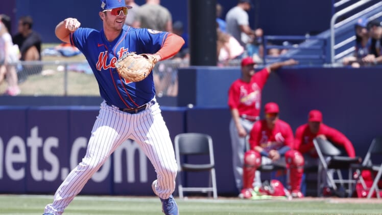 Mar 27, 2022; Port St. Lucie, Florida, USA; New York Mets first baseman Pete Alonso (20) throws to the pitcher covering first base for an out during the second inning of a spring training game against the St. Louis Cardinals at Clover Park. Mandatory Credit: Reinhold Matay-USA TODAY Sports