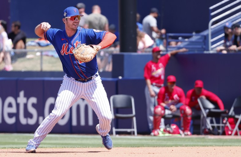 Mar 27, 2022; Port St. Lucie, Florida, USA; New York Mets first baseman Pete Alonso (20) throws to the pitcher covering first base for an out during the second inning of a spring training game against the St. Louis Cardinals at Clover Park. Mandatory Credit: Reinhold Matay-USA TODAY Sports